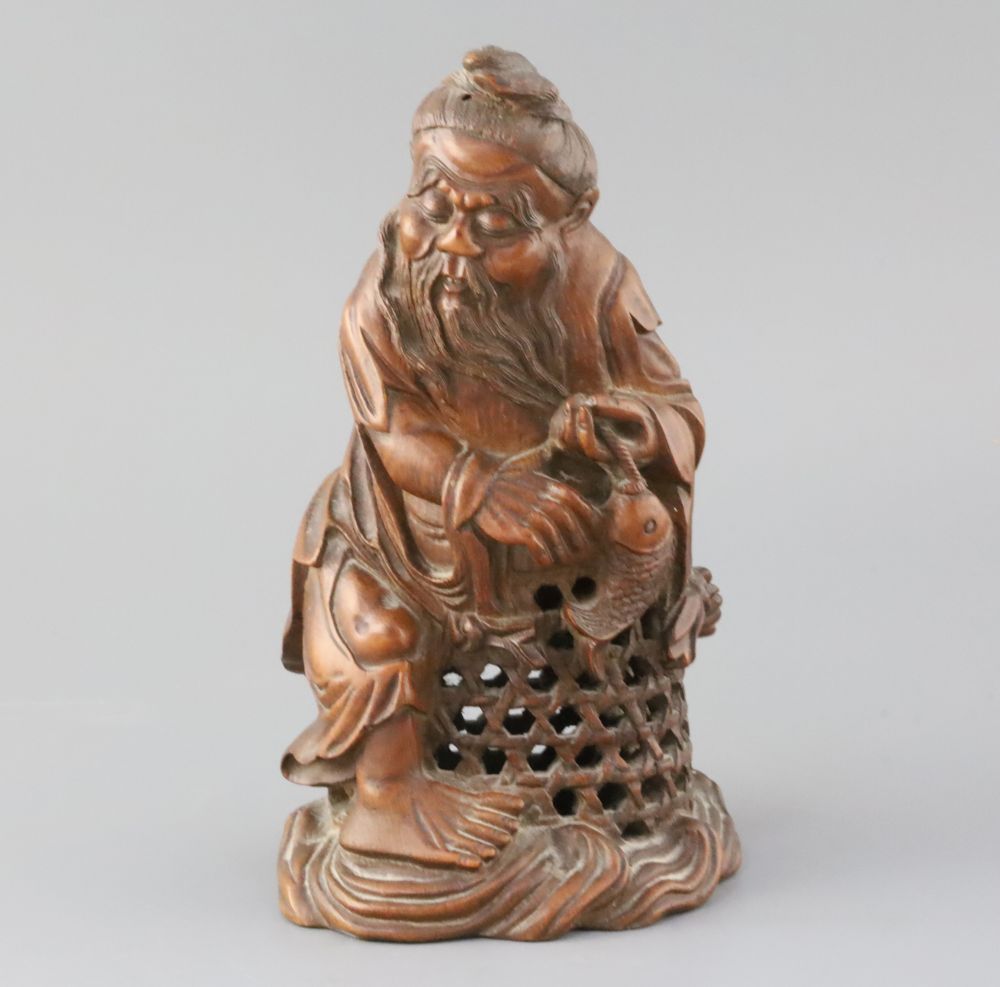 A Chinese bamboo figure of a fisherman, late 19th/early 20th century, H. 23.5cm